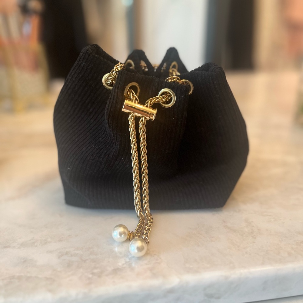 Black corduroy crossbody bag with pearl hanging